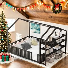 a christmas tree is in the corner of a room with a baby's crib