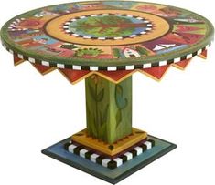 a colorful table with an elaborate design on it's top and bottom part in the shape of a tree