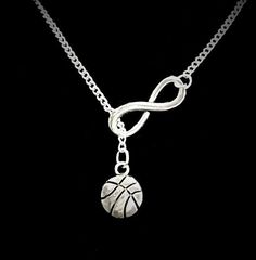 a silver necklace with a basketball on it