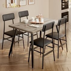 a dining room table with four chairs around it