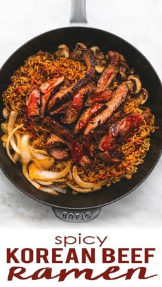 the korean beef ramen is being cooked in a skillet