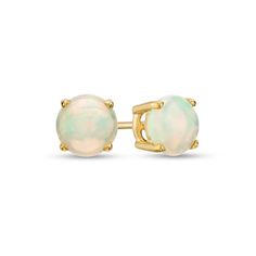 Simple and chic, these gemstone stud earrings add color to any style. Fashioned in warm 10K gold, each earring showcases a 6.0mm iridescent opal cabochon solitaire. Buffed to a brilliant luster, these post earrings secure comfortably with friction backs. Classic Opal Jewelry With Round Cut, Classic Round Cut Opal Jewelry, Formal Opal Round Earrings, Formal Round Opal Earrings, Opal Earrings Stud, Solitaire Studs, Gemstone Stud Earrings, Opal Studs, Gemstone Studs