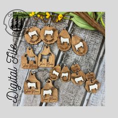 the wooden earrings are decorated with farm animals and names on them, as well as flowers