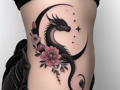 a woman's thigh with a dragon and flowers tattoo on her side ribcage