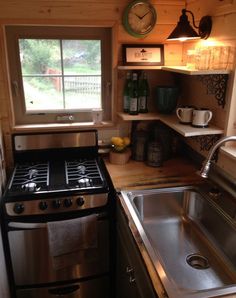 small kitchen with stainless steel stove and sink