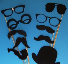 the photo props are made to look like mustaches and glasses