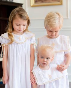 A white cotton dress with an embroidered cream cross on the collar makes this vintage style dress the perfect outfit for a Christening or Baptism. Sleeves and collar have a cream lace detail. Each sleeve has a cream silk ribbon for a sweet bow. Fully lined and length of a bishop dress. Baby Blessing Dress, Girls Baptism Dress, Blessing Dress, Sibling Outfits, Baptism Outfit, Girls Easter Dresses, Baby Blessing, Baptism Dress, White Cotton Dress