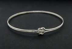 Double love knot bangle sterling silver by TDNCreations on Etsy Elegant Sterling Silver Bracelet For Friendship, Elegant Sterling Silver Jewelry For Friendship, Silver Sliding Knot Bangle Bracelet, Silver Sliding Knot Bangle Bracelets, Silver Bangle Bracelet With Sliding Knot, Elegant Handmade Jewelry For Friendship, Silver Friendship Jewelry With Sliding Knot, Elegant Silver Bracelet With Sliding Knot, Elegant Silver Jewelry For Friendship