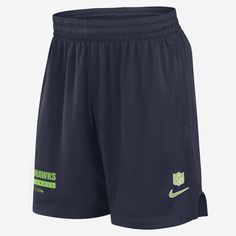 Featuring Seattle Seahawks details at the hem, these Sideline Shorts are designed with sweat-wicking technology and mesh fabric for a dry, breathable wear. The adjustable waistband helps create a flexible fit. Navy Nike Activewear For The Gym, Navy Nike Sporty Athletic Shorts, Nike Navy Sporty Athletic Shorts, Nike Sporty Navy Athletic Shorts, Navy Nike Sports Shorts, Navy Athletic Shorts With Elastic Waistband For Sports, Nike Navy Sports Shorts, Navy Athletic Shorts With Elastic Waistband, Nike Moisture-wicking Bottoms For Sports Events