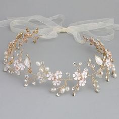 a bridal headpiece with pearls and bows