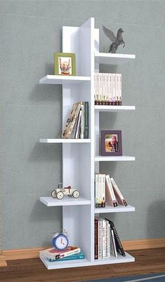 a white book shelf with books on it