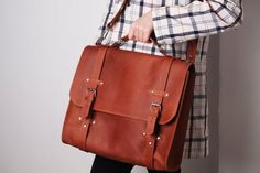 Bag.Link to the bags section - https://www.etsy.com/shop/Pikore?ref=shop_sugg&section_id=24287075Looking for a satchel bag that will be spacious enough to carry your laptop but simple and elegant in design? A leather women laptop bag is an ideal solution to meet your demands.MAIN CHARACTERISTICS:- Sizes:🔸 The bag is made according to the dimensions of your laptop. (Please, leave your laptop dimensions in the Notes box at the checkout page).- Pockets:  Front internal: 🔸 Smartphone pocket; ? School Tote Briefcase With Laptop Sleeve, School Briefcase With Laptop Sleeve In Tote Style, School Satchel Briefcase With Laptop Sleeve, School Briefcase With Laptop Sleeve And Satchel Shape, School Satchel With Laptop Sleeve Crossbody, Laptop Briefcase Women, Handmade Leather Laptop Bag, Handmade Laptop Bag, Leather Office Bags