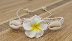 "Handmade Plumeria Flower Hemp Bracelet. Also available in a variety of colors to choose from. 🌿Natural Color Hemp Cord -with 3 Hawaiian Plumeria Flower Charms 🌸Plumeria Flower Meaning: In Hawaiian culture, the plumeria symbolizes Positivity & New Life and is used to celebrate special occasions. 💕Fits Most Size- Pull the knots to adjust to you wrist. Adjustable from 5\" Inches up to 10\" Inches Around Wrist of Anklet. Wear this beautiful design as a bracelet or anklet. 💫Handmade - Hawaii Hawaiian Bracelets, Eye Of Horus Necklace, Hawaiian Plumeria, Hemp Bracelet, Hemp Bracelets, Hawaiian Flower, Hawaiian Culture, Flower Meanings, Jewelry Flower