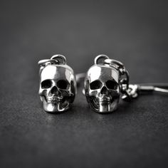 Handmade sterling silver 925 hung 3D skull earrings. Each earring is cleaned and polished with care. Approx weight: 2.75gr (each) Skull hight: 11.64mm Skull width: 8mm The earring is made of sterling silver 925 and is water resistant. *The listing is for ONE earring Here are some listings that you might also love: https://www.etsy.com/il-en/listing/560249661/skull-necklace-silver-skeleton-skull https://www.etsy.com/il-en/listing/528268224/skull-nacklace-sterling-silver-silver https://www.etsy.co Gothic Sterling Silver Jewelry With Skull Print, Silver Skull Earrings For Pierced Ears, Gothic Sterling Silver Skull Earrings, Silver Skull Earrings With Skull Print, Silver Skull Earrings With Ear Wire, Nickel Free Sterling Silver Skull Ring, Nickel-free Sterling Silver Skull Ring, Handmade Sterling Silver Skull Earrings, Skull Shaped Metal Earrings