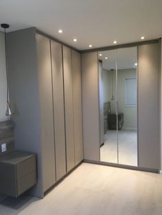 an empty room with mirrored closet doors