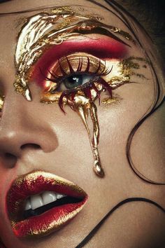 an image of a woman with makeup on her face and gold eyeshades,