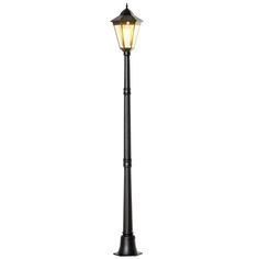 a black lamp post with a light on it's top and the base is lit up