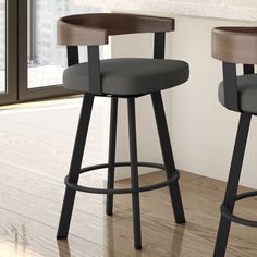 two black and brown barstools in front of a window