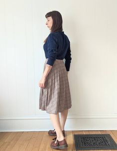 "Vintage Pleated Plaid Skirt  era: 1970s Polyester Wool Acrylic blend  Made in Canada by Paris Star Tag reads \"14\" Below the Knee Length Cut High Waisted Elastic Waist Band Good Vintage Condition. The pleats are no longer crisp and the waistband is starting to lose stretchiness, still cute and wearable. MEASUREMENTS Waist 28\" to 32\" Hips 60\" (full) Length 27\" MODEL MEASUREMENTS: HEIGHT 5' 4\" BUST 34\" WAIST 28\" HIPS 36\" Combine multiple items to save on shipping!  Be sure to check out our shop policies!" Vintage Pleated Skirt For Fall, Vintage Flared Skirt Bottoms For Fall, Vintage Flared Skirt For Fall, Vintage Fall Pleated Skirt, Vintage Pleated Bottoms For Fall, Vintage Full Pleated Skirt For Fall, Vintage Lined Skirt For Fall, Vintage Skirt For Fall, Vintage Midi Skirt Bottoms For Fall