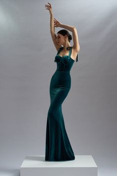 The Cybele dress gives off elegance and sophistication with a long and simple cut.    Long evening mermaid dress, made of velvet  Long velvet skirt, with waistband made of velvet,inserted at the waist, silk satin lining for extra comfort  Hook and fastenings zip at back  Internal boned bodice and incorporated push-up cups for support  Dry clean  Shown color: green  Made In EU Velvet Silk Dress, Prom Dress Mermaid, Velvet Evening Dress, Silk Evening Dress, Formal Wear Dresses, Boned Bodice, Designer Evening Gowns, Dress Mermaid, Velvet Gown