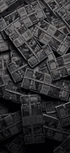 black and white photograph of many stacks of money