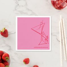 a pink card with a drawing of a man holding a cocktail glass and strawberries next to it