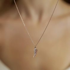 The symbolic Wing Charm Necklace is the ideal present for a loved one or for yourself. You will be charmed by this necklace and it will be a wonderful addition to your collection of designer accessories. Metal: 925 sterling silver Coating: 18k gold Pendant: 3.2 x 1.0 cm (1.25" x 0.4") Stones: cubic zirconia Chain style: cable link Chain length: 40 cm + 5 cm extender (16" + 2") Hypoallergenic: nickel-free materials used therefore suitable for those with metal allergies Rose Gold Necklace With Adjustable Chain For Her, Rose Gold Pendant Charm Necklace With Clavicle Chain, Dainty Rose Gold Pendant Jewelry, Rose Gold Jewelry With Adjustable Chain Pendant, Rose Gold Sterling Silver Jewelry With Delicate Chain, Rose Gold Jewelry With Adjustable Chain For Gifts, Dainty Rose Gold Pendant Necklace, Minimalist Rose Gold Jewelry With Charms, Fine Jewelry Rose Gold Charm Necklaces