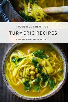 a bowl filled with yellow pasta and greens