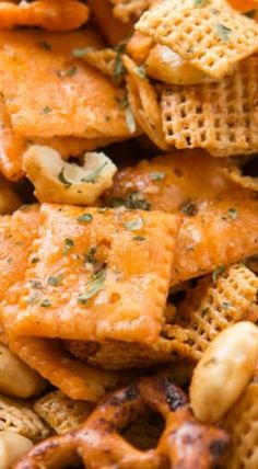 cheesy crackers and nuts are piled up in a pile on the table