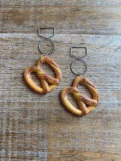 Handmade with acrylic pretzel mini brands collectibles. Lightweight.  Regular Earrings- 2 1/8 inches long.  Tunnel Earrings- 2 5/8 inches long. (ready to ship!) Clip On Earrings- 2 1/8 inches long. Polymer Clay Pretzel, Pretzel Earrings, Spiral Ear Gauges, Salted Pretzel, Centre Commercial, Ear Hangers, Ear Weights, Soft Pretzels, Gauged Earrings