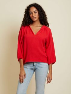 A modern version of the peasant style top in effortless, breezy Double Gauze. Elastic at 3/4 length voluminous sleeve. Raw hem. (This one comes in Cherrybomb.) | Women's Mimi Blouse Top in Cherrybomb | Ethical Essentials Daywear Tops With Blouson 3/4 Sleeves, Daywear Tops With Blouson Sleeves And 3/4 Sleeve, Casual Tops With Blouson Sleeves For Brunch, Casual Blouson Sleeve Top For Brunch, Flowy Fall Blouse With 3/4 Sleeves, Versatile 3/4 Sleeve Spring Blouse, Versatile Relaxed Fit Tops For Brunch, Relaxed Fit Tops With 3/4 Sleeve For Daywear, Relaxed Fit 3/4 Sleeve Tops For Daywear