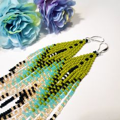 "Seed Bead Earrings 5 inch long.Flowing beads earrings.Bohemian dangle beaded earrings. with fringe are made of high quality Czech and Japanese seed beads.V long earrings.Bead weaving techniques. Colors: Green khaki,black,peach,turquoise. ! Details ! Made with quality Japanese and Czech seed beads ! Professional threads for weaving with beads Tytan and Fireline. ! Length 5 inches ( 13cm) ! Sterling silver plated ear wire. Simple sterling silver ear wire 925 are included with each earrings. ! Wei Bohemian Green Beaded Fringe Earrings, Green Beaded Earrings With Fringe For Summer, Green Dangle Chandelier Earrings For Summer, Bohemian Green Beaded Fringe Chandelier Earrings, Summer Green Dangle Chandelier Earrings, Bohemian Green Chandelier Earrings For Summer, Bohemian Green Chandelier Earrings With Colorful Beads, Green Bohemian Chandelier Earrings With Colorful Beads, Bohemian Green Long Drop Earrings