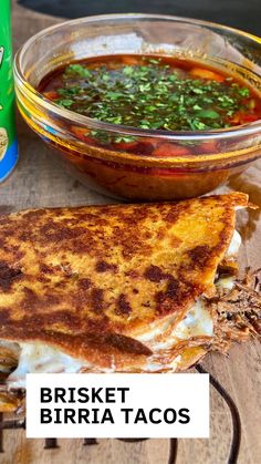 a grilled cheese sandwich next to a bowl of salsa