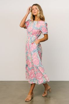 Get our brand new Myers Dress that comes in a Blue and pink floral. The floral print will leave you feeling stunning! Pink Floral Dress With Smocked Back For Garden Party, Pink Floral Dress With Smocked Back, Feminine Floral Midi Dress With Smocked Back, Pink Midi Dress With Smocked Back, Feminine Pink Midi Dress With Smocked Back, Fitted Pink Maxi Dress With Smocked Back, Spring Pink Midi Dress With Smocked Back, Pink Midi Dress With Smocked Back For Daywear, Skirt Lining