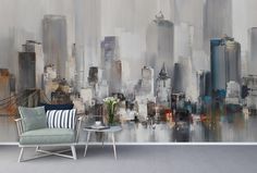 an abstract cityscape is featured on the wall in this living room with a chair and coffee table