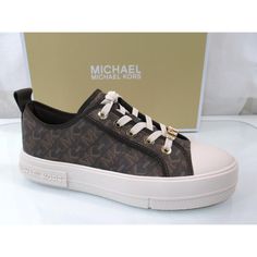 Style Name Evy Lace Up 43h3eyfs1b Shoe Style - Lace Up Low Top Logo Sneakers - Empire Signature Logo Sneaker Material Man-Made Upper Heel Height Approx. 1.25 Inch Platform Heel Details Elevate Your Favorite Casual Looks With These Stylish Sneakers From Michael Michael Kors. - Tonal Trim For An Elegant Finish - Logo Print Canvas - Lace Up Fastening Out-Sole Rubber Out-Sole Low-top Brown Sneakers With Logo, Brown Low-top Sneakers With Logo, Brown Low-top Sneakers With Logo Print, Brown Round Toe Sneakers With Logo Print, Brown Sneakers With Logo Print And Round Toe, Michael Kors Low-top Sneakers With Branded Heel, Michael Kors Brown Low-top Sneakers, Casual Platform Sneakers With Logo, Sneakers Brown