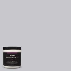 a jar of dymasty colorante on a gray background