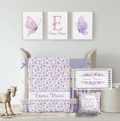 a baby's nursery room with butterfly prints on the wall