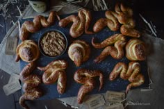 there are many different types of breads on the table