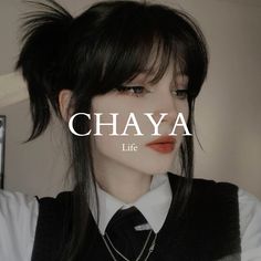 a woman with black hair wearing a white shirt and tie, has the words chaya life written across her face