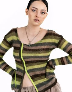 A fitted striped knit sweater will become a vibrant addition to your wardrobe. The long sleeves, which flare at the cuffs and feature slits adorned with colorful trim, add originality and elegance. The asymmetric neckline gives the sweater a unique charm and modern look.Product details: Sleeve length: 70 cm / 27,6 in Back length: 60 cm / 23,6 in Model: height 178 cm / 70 in; bust: 88 cm / 34,7 in; waist: 63 cm / 24,8 in; hips: 93 cm / 36,6 in, size XSSeason: Spring/SummerComposition: 50% PE, 25% WO, 15% VI, 10% MEMachine delicate wash: 40°C. Spin: 600-800 rpm. Do not tumble dry.About the brand:7/11 Seven Eleven has been working since July 2015.The brand creates qualitative unisex, obscenely feminine, ultrasexual fashion models."We are for style, not for fast fashion - for all those who lik Multicolor Textured Knit Long Sleeve Tops, Vintage Multicolor Hand Knitted Sweater, Playful Long Sleeve Knit Cardigan, Multicolor Hand-knitted Long Sleeve Cardigan, Vintage Multicolor Hand-knitted Sweater, Striped Knit, Unique Charms, Fast Fashion, Cloth Bags