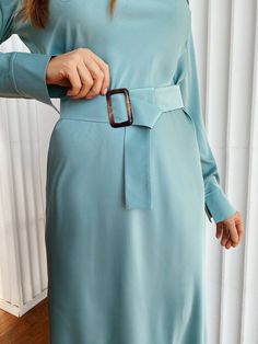 This silk long sleeve dress is modest and elegant. The belt underlines the waistline and transforms the body contour. The fabric is very pleasant to touch. Owing to the bias cut of the fabric, it ripples nicely and attractively. Perfect modest outfit for wedding guests, bridesmaids, birthdays, anniversaries and office. DETAILS - long-sleeved silk dress - bias cut dress - belted - hits at mid-calf - model is wearing a size S - modest dress MATERIAL Silk and polyester blend SIZES Dress length is 4 Spring Long Sleeve Midi Dress With Belt, Blue Chic Belted Dress For Formal Occasions, Chic Blue Belted Dress For Formal Occasions, Long Sleeve Midi Dress With Belt, Fitted Long Sleeve Maxi Dress With Belt, Long Sleeve Belted Office Dress, Long Sleeve Light Blue Dress For Work, Modest Belted Midi Dress, Long Sleeve Midi Dress With Belt For Work