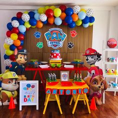 a paw patrol birthday party with balloons and decorations