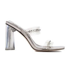 Step into elegance with the Zeta heeled mule, embellished with sparkling rhinestone clear bands. This stunning shoe is a true head-turner, perfect for special occasions where you want to shine. The sleek design and shimmering details add a touch of glamour to any outfit. Whether it's a wedding, gala, or evening event, the Zeta heeled mule ensures you'll make a sophisticated statement with every step. Elevate your style and let your feet do the talking with this exquisite pair. Glamorous Clear Sandals With Rhinestones, Embellished Clear Open Toe Heels, Silver High Heels With Clear Strap, Party Sandals With Branded Heel Counter, Clear Open Toe Heels With Rhinestones, Silver Heels With Clear Strap For Evening, Formal Heels With Clear Strap And Synthetic Material, Formal Silver Sandals With Clear Strap, Formal Heels With Clear Strap