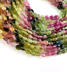 100% Natural Multi Tourmaline Gemstone Oval Beads | Gemstone Tourmaline Smooth Oval Nuggets |Tourmaline Necklace Size - 4x5 - 4x7 MM Approx. TOP QUALITY TOURMALINE Nuggets SIZE - 4x5 - 4x7 MM Approx. Natural Watermelon Tourmaline Length - 14 Inch Contact for bulk Quarries Oval Tourmaline Gemstones, Multicolor Beaded Tourmaline Jewelry, Multicolor Faceted Tourmaline Bead Jewelry, Oval Tourmaline Natural Gemstones, Multi-stone Tourmaline Gemstones, Watermelon Tourmaline Necklace, Tourmaline Earrings, Oval Beads, Tourmaline Necklace