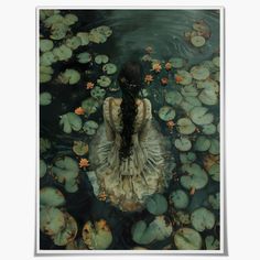 a woman is sitting in the water surrounded by lily pads and lillilies, with her back to the camera