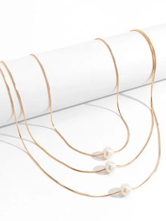 Simple Multilayer Pearl Necklaces – Timeless Elegance for Every Occasion White Multi-strand Clavicle Chain Necklace, White Pearl Double Strand Layered Necklace, White Double Strand Pearl Layered Necklace, White Multi-strand Clavicle Chain Jewelry, White Multi-strand Layered Necklace With Pearl Chain, White Multi-strand Layered Pearl Necklace, White Double Strand Layered Jewelry, White Layered Double Strand Jewelry, Adjustable White Layered Clavicle Chain Necklace