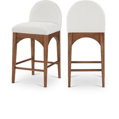 two white upholstered bar stools against a white background, one with an oval back and the other without