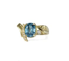 Gold & Stone Ring - This deep aqua blue zircon is set in 14k yellow gold with diamond accents. It is a rich colored stone with excellent saturation that measures 9.7mm x 7.3mm. In the Middle Ages, this gem was thought to induce sound sleep, drive away evil spirits, and promote riches, honor, and wisdom. Gold Stone Ring, Blue Zircon Ring, Keum Boo, Colored Stone, Artful Home, The Middle Ages, Zircon Ring, Gold Stone, Evil Spirits