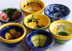 six bowls with different designs on them sitting next to each other